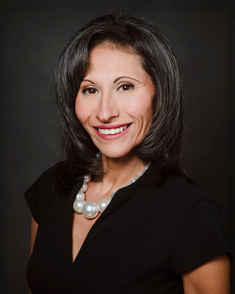 Dark background low key female headshot