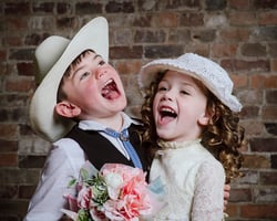 cousins laughing during a vintage studio photoshoot