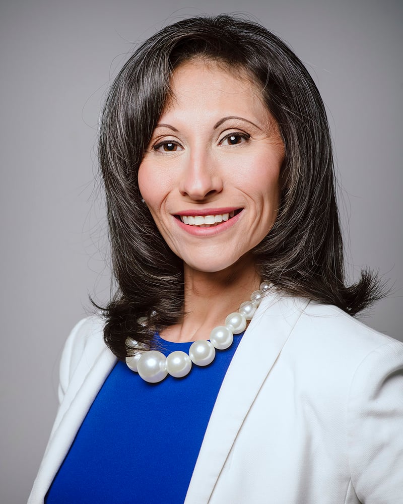 Light background white blazer female headshot
